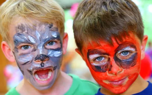 a group of people with paint on their faces