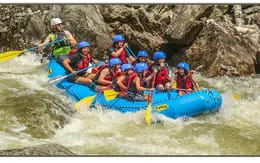 a group of people in a raft