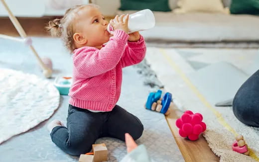 a baby drinking from a bottle