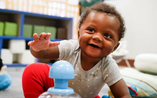 a baby playing with a toy