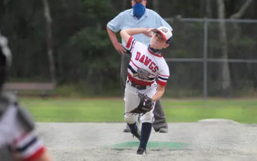 a baseball player throwing a ball