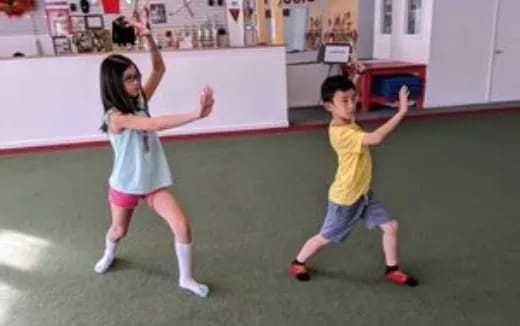 a boy and girl dancing