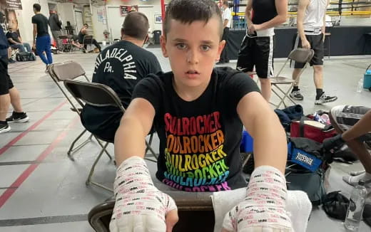 a boy sitting in a chair