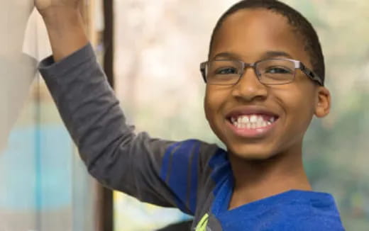 a boy wearing glasses