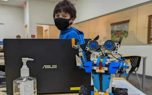 a boy working on a computer