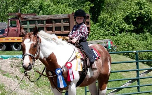 a girl riding a horse