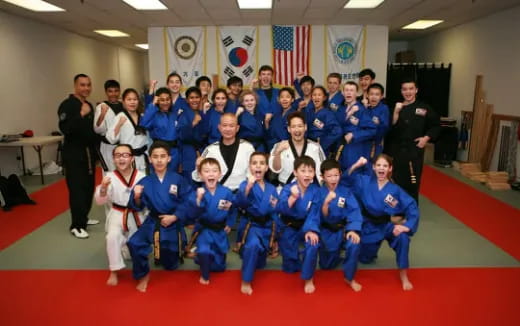 a group of children in blue uniforms