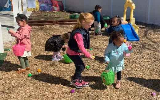 a group of children playing in a playground