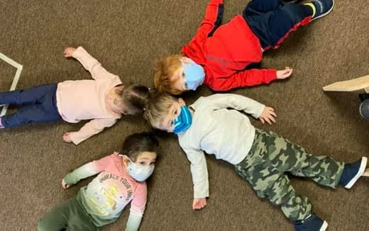 a group of children playing on the ground