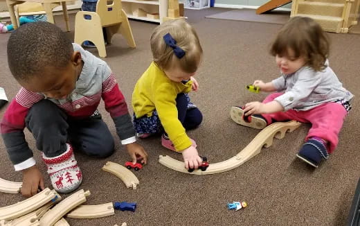 a group of children playing with toys