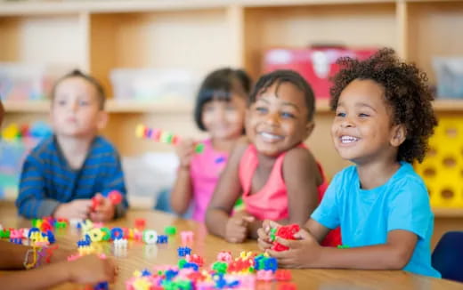 a group of children playing with toys