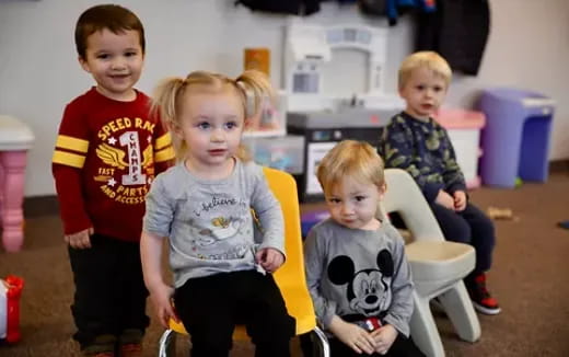 a group of children posing for a photo