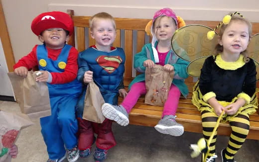 a group of children sitting on a couch