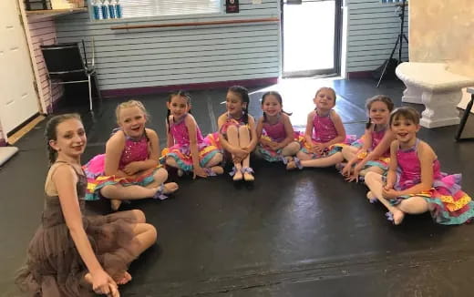 a group of children sitting on the floor