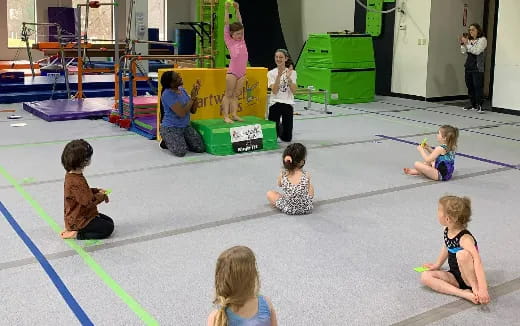 a group of children sitting on the floor