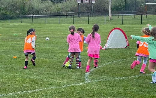 a group of girls playing football