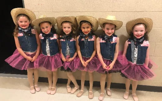 a group of girls wearing hats