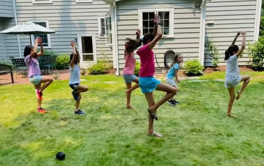 a group of kids playing football