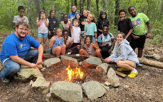 a group of people around a fire