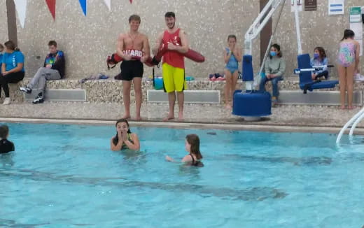 a group of people in a pool