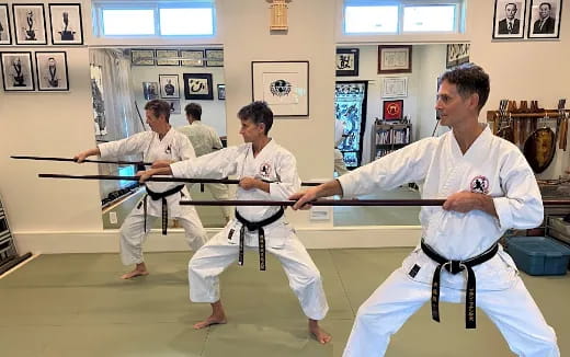 a group of people in karate uniforms