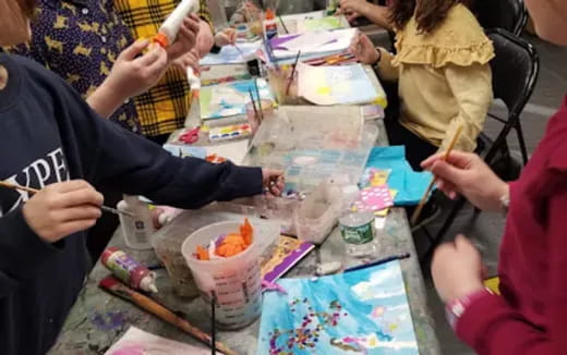 a group of people painting