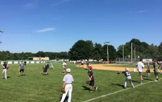 a group of people playing baseball