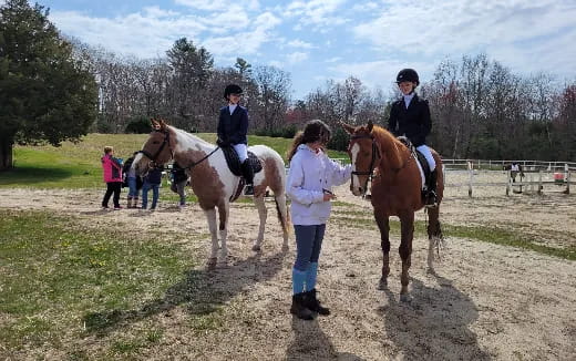 a group of people riding horses