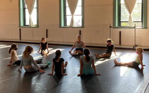 a group of people sitting on the floor