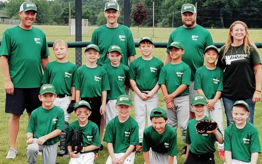 a group of people wearing green uniforms