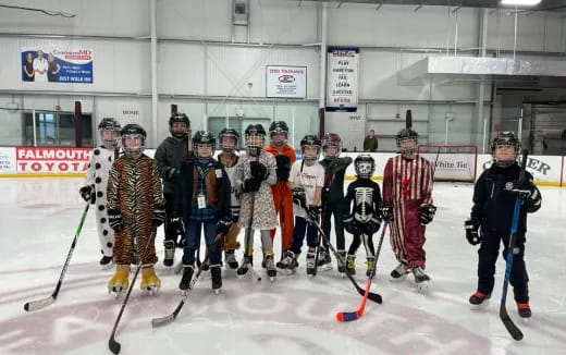 a group of people wearing hockey gear