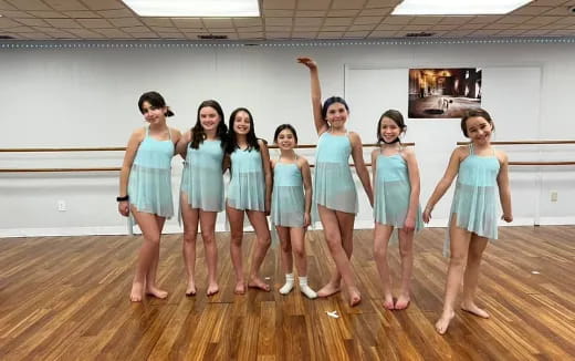 a group of women in dresses