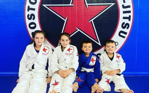 a group of women in karate uniforms