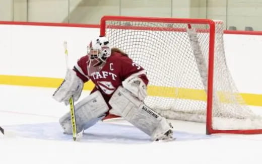 a hockey player in a red uniform