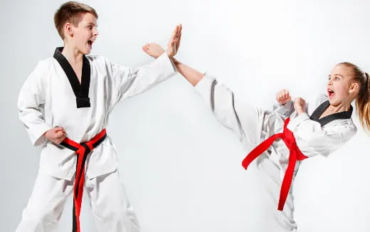 a man and a woman in karate uniforms