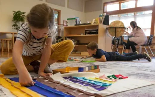 a person and a child painting