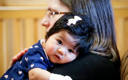 a person holding a baby