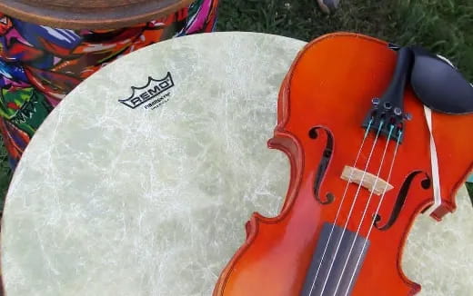 a red guitar next to a white guitar