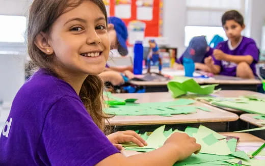 a young girl smiling