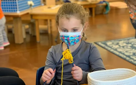 a young girl with a face mask