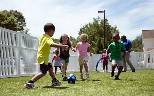 kids playing football on a field