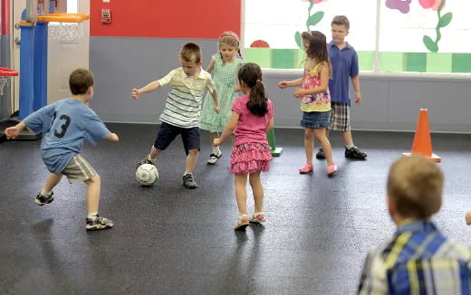 kids playing with a football ball