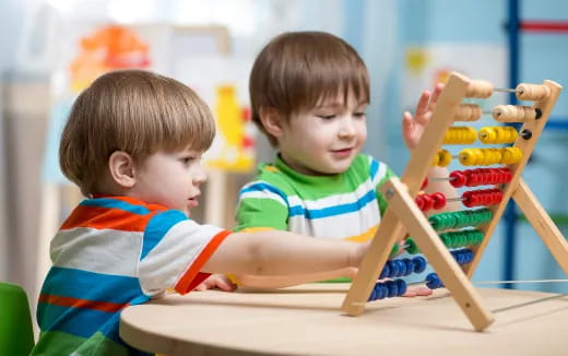 two boys playing with toys