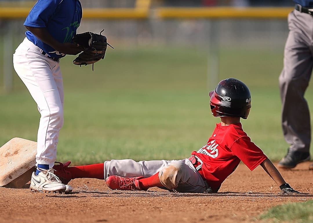 two boys playing baseball