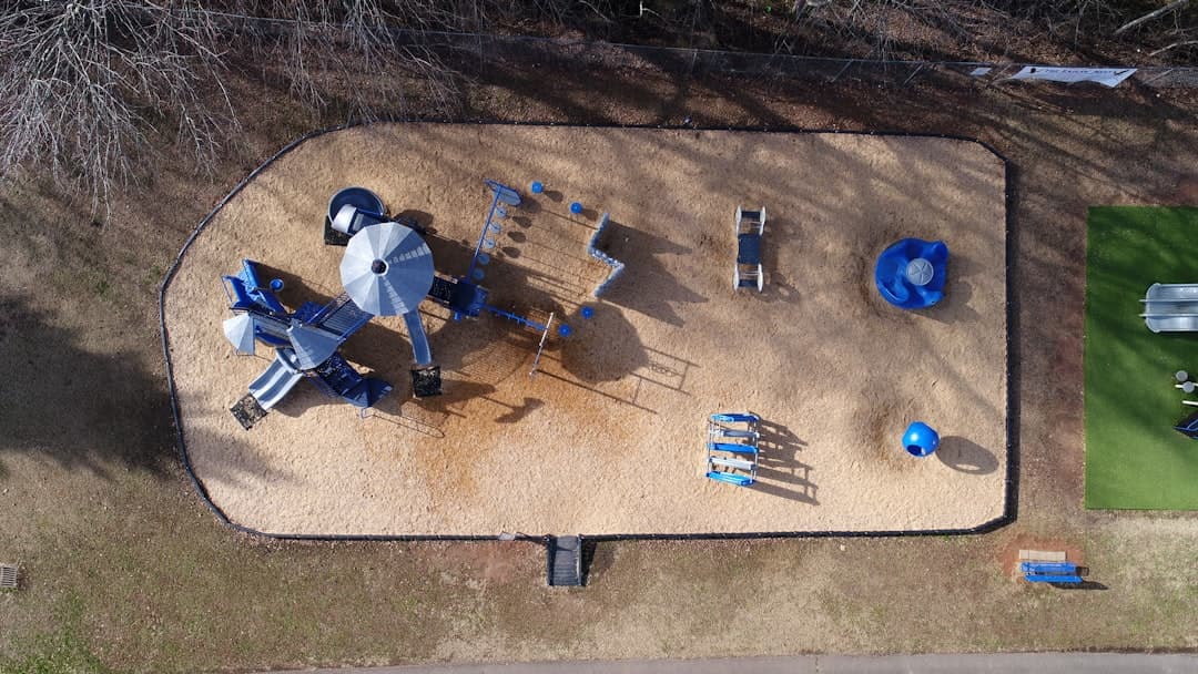 aerial photograph of toddler's park on sand