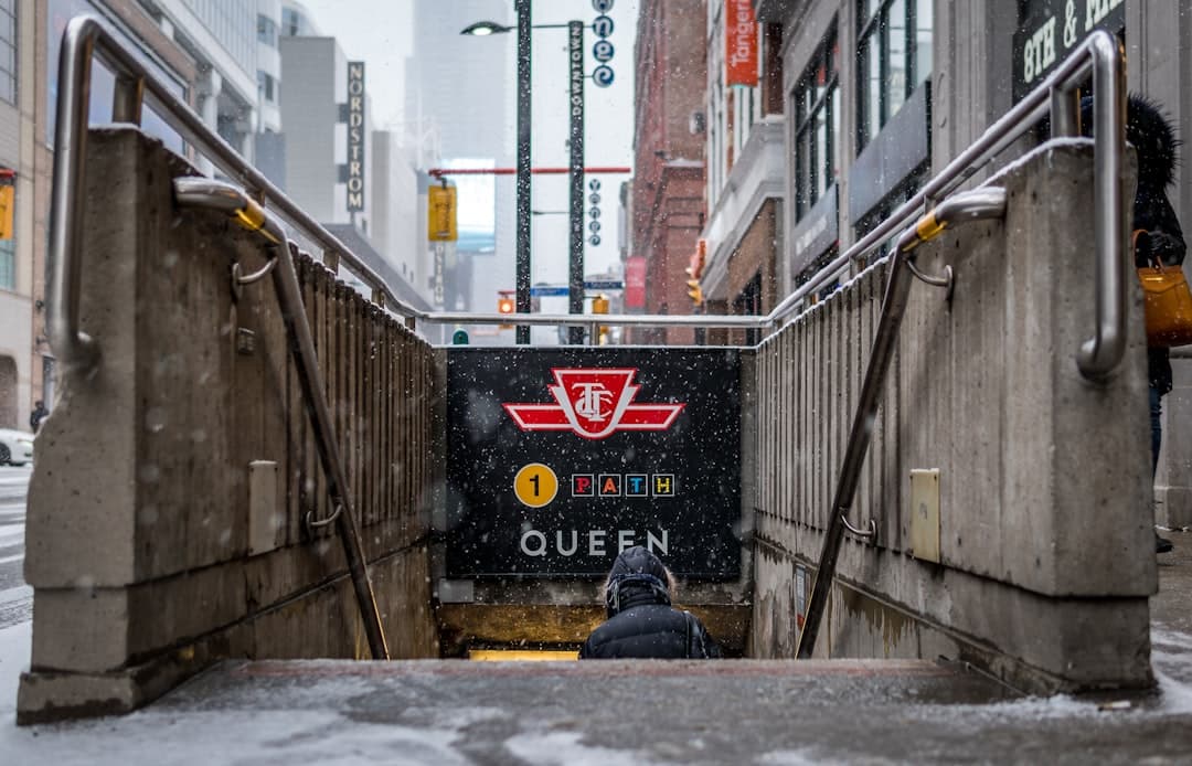 person going down to subway station