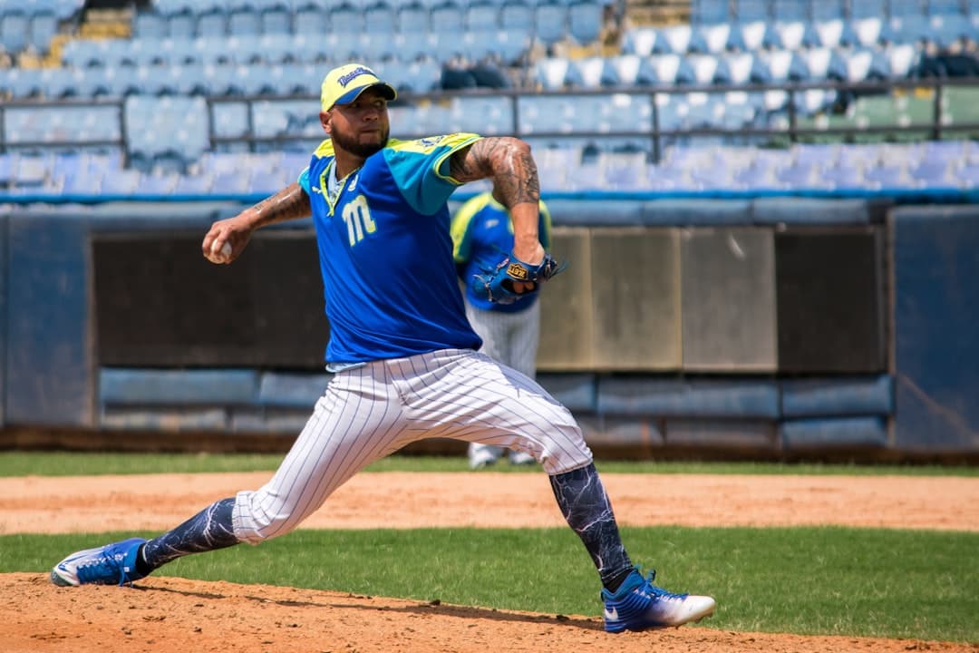 man pitching the baseball