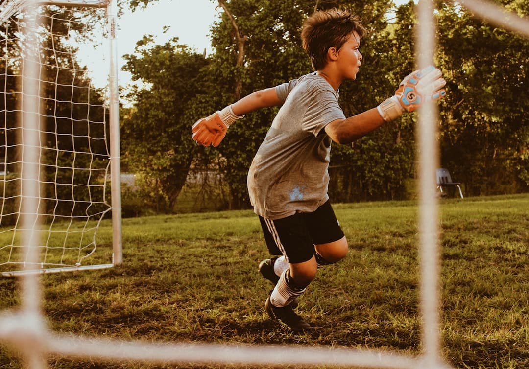 boy playing soccer