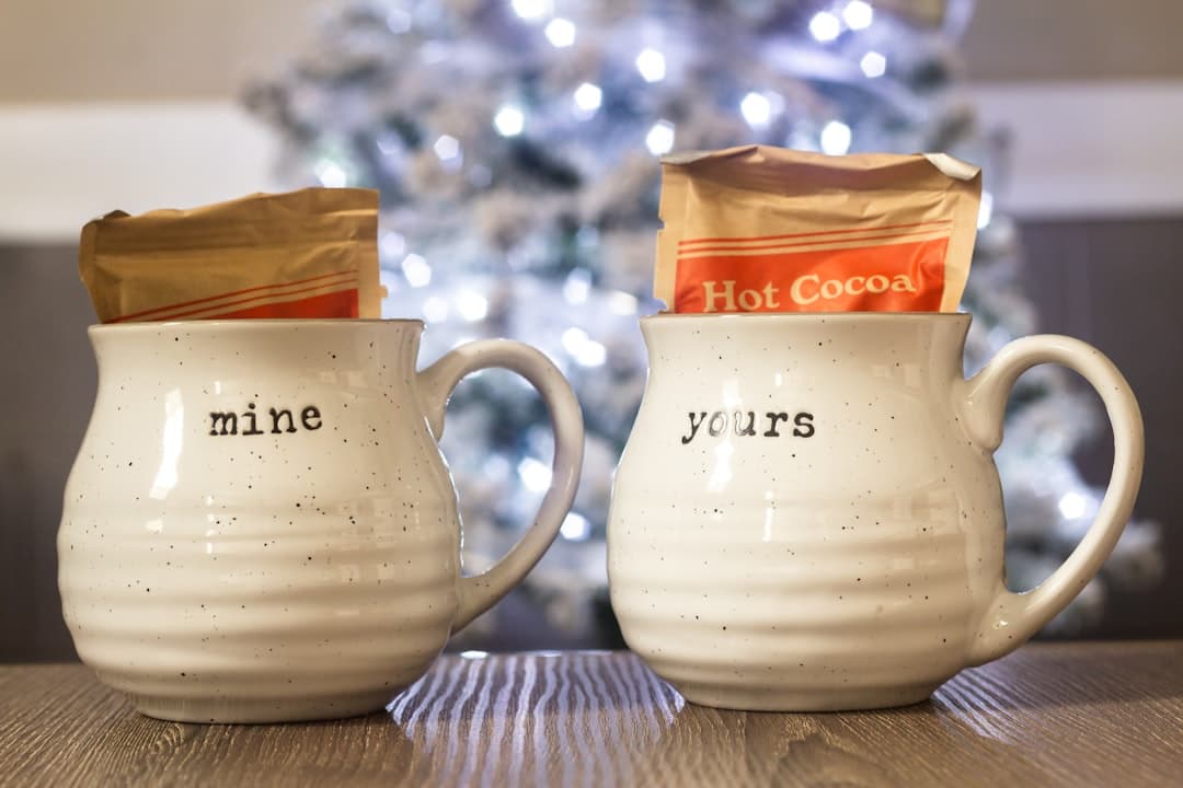 two shallow focus photo of white ceramic mugs