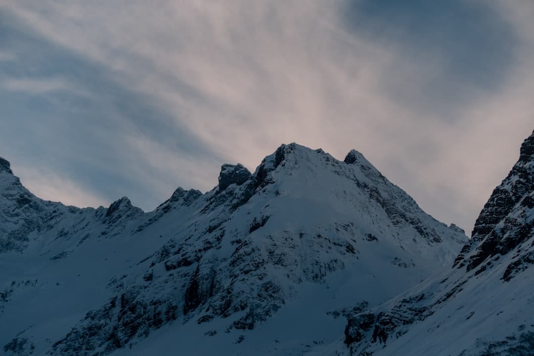 snow mountain under clouds